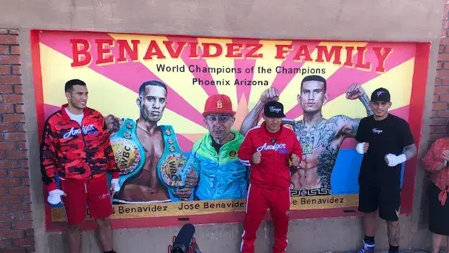 The Benavidez family stand outside Central Boxing Gym in Phoenix that Jose Snt, center, is purchasing