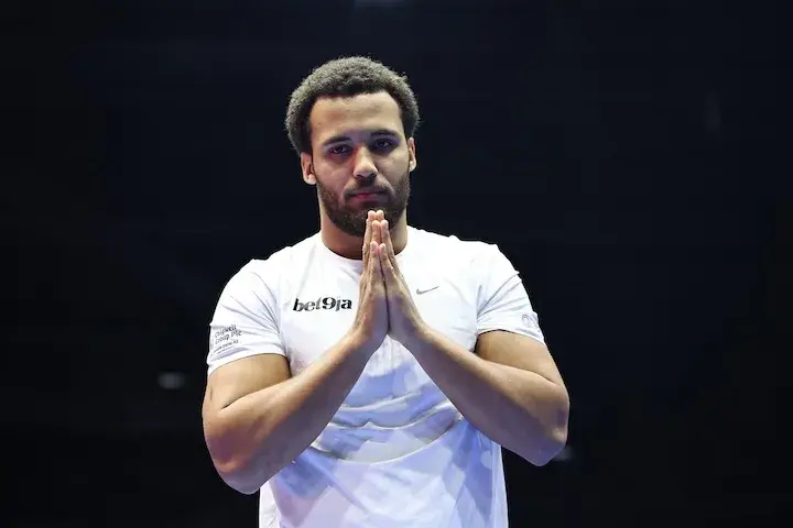 Moses Itauma stands with hands clasped together at a media workout on August 13, 2025, ahead of his fight with Dillian Whyte.