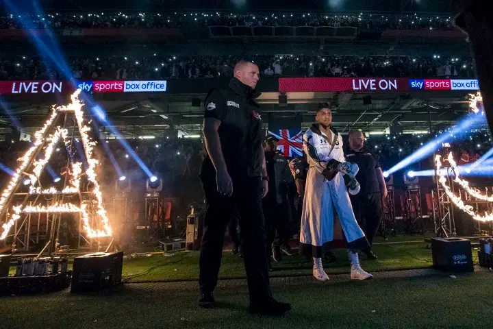 Anthony Joshua walks to the ring ahead of his 2017 bout with Carlos Takam at the Principality Stadium in Cardiff, Wales