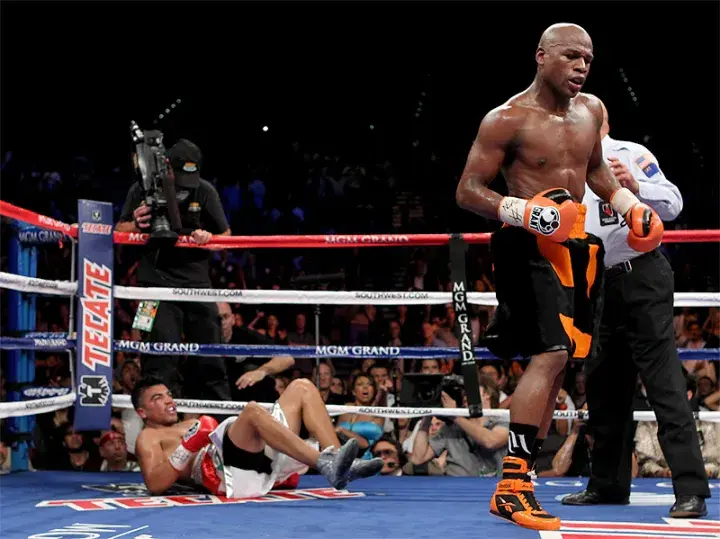 Floyd Mayweather walks away from Victor Ortiz in the fourth round of their September 2011 showdown