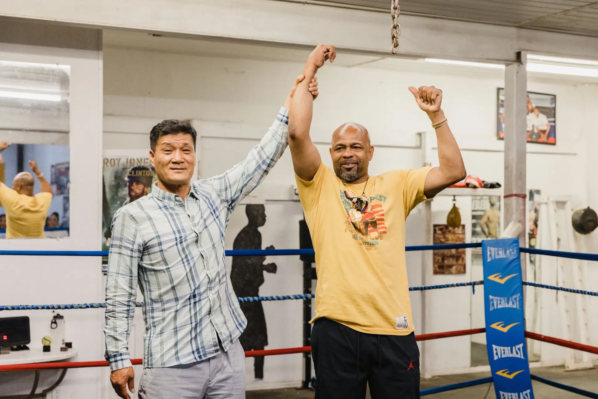 Park Si Hun symbolically holds up Roy Jones Jnr's hand, nearly four decades after their Olympic gold medal match