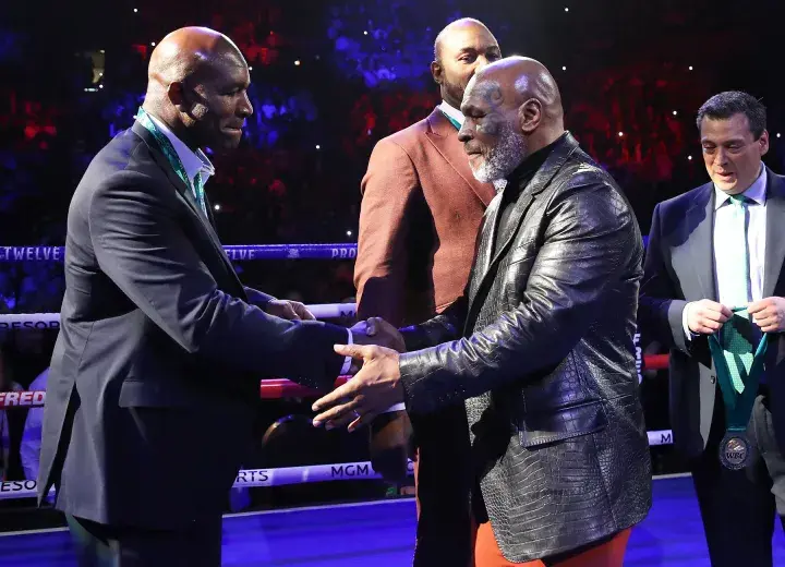 Evander Holyfield and Mike Tyson are reunited several years after their infamous 'bite fight'