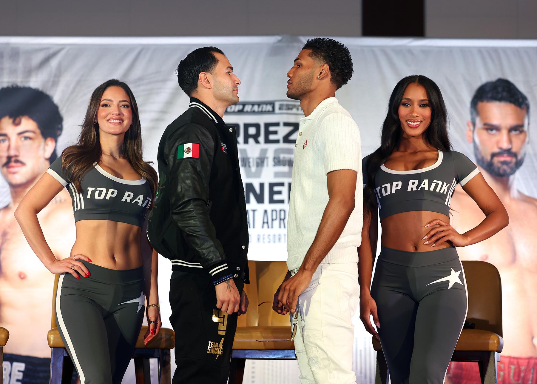 Lindolfo Delgado (L) and Elvis Rodriguez (R) face off.