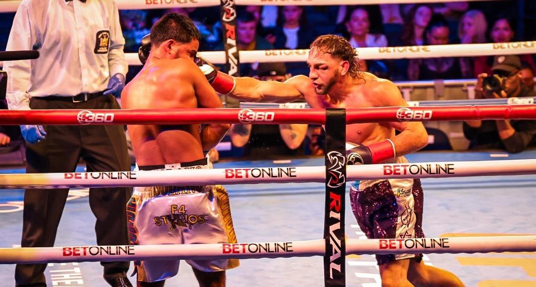 Cletus Seldin lands a right hand on Yeis Solano.