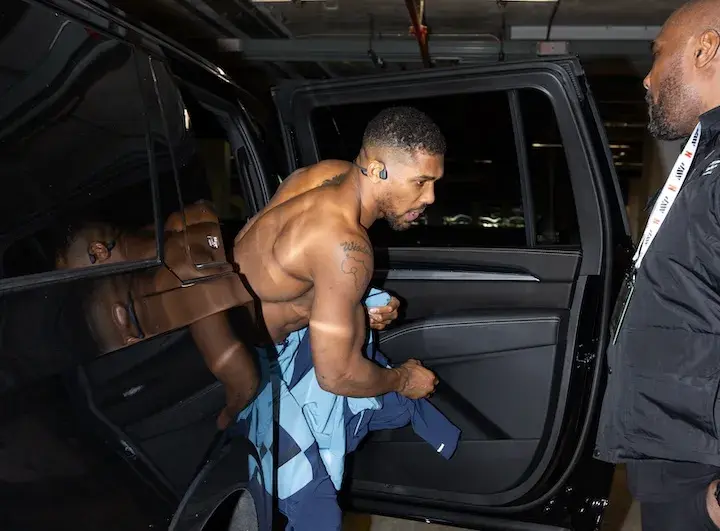Anthony Joshua exits a vehicle at the media workout on December 16, 2025, ahead of his boxing match with Jake Paul.