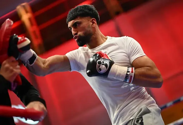 Adam Azim punches a pad during a media workout on November 12, 2025, ahead of his boxing match with Kurt Scoby.