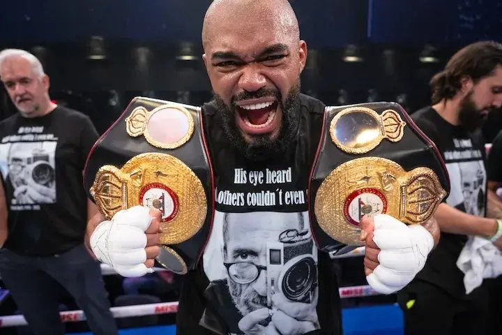 Albert Ramirez holds two title belts after winning a fight on June 5, 2025.