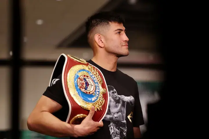 Alexis Rocha poses with a WBO belt