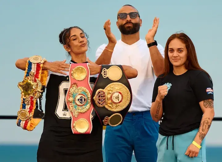 Amanda Serrano poses with her world championships onstage with opponent Reina Tellez and promoter Nakisa Bidarian of Most Valuable Promotions ahead of their fight in January 2026.