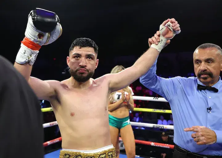 Andres Cortes has his arm raised in victory on May 10, 2025 in San Diego, California.