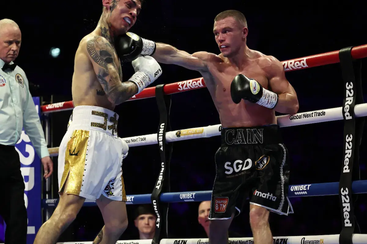 Andrew Cain fires a right hand to thwart the forward march of Alejandro Jair Gonzalez