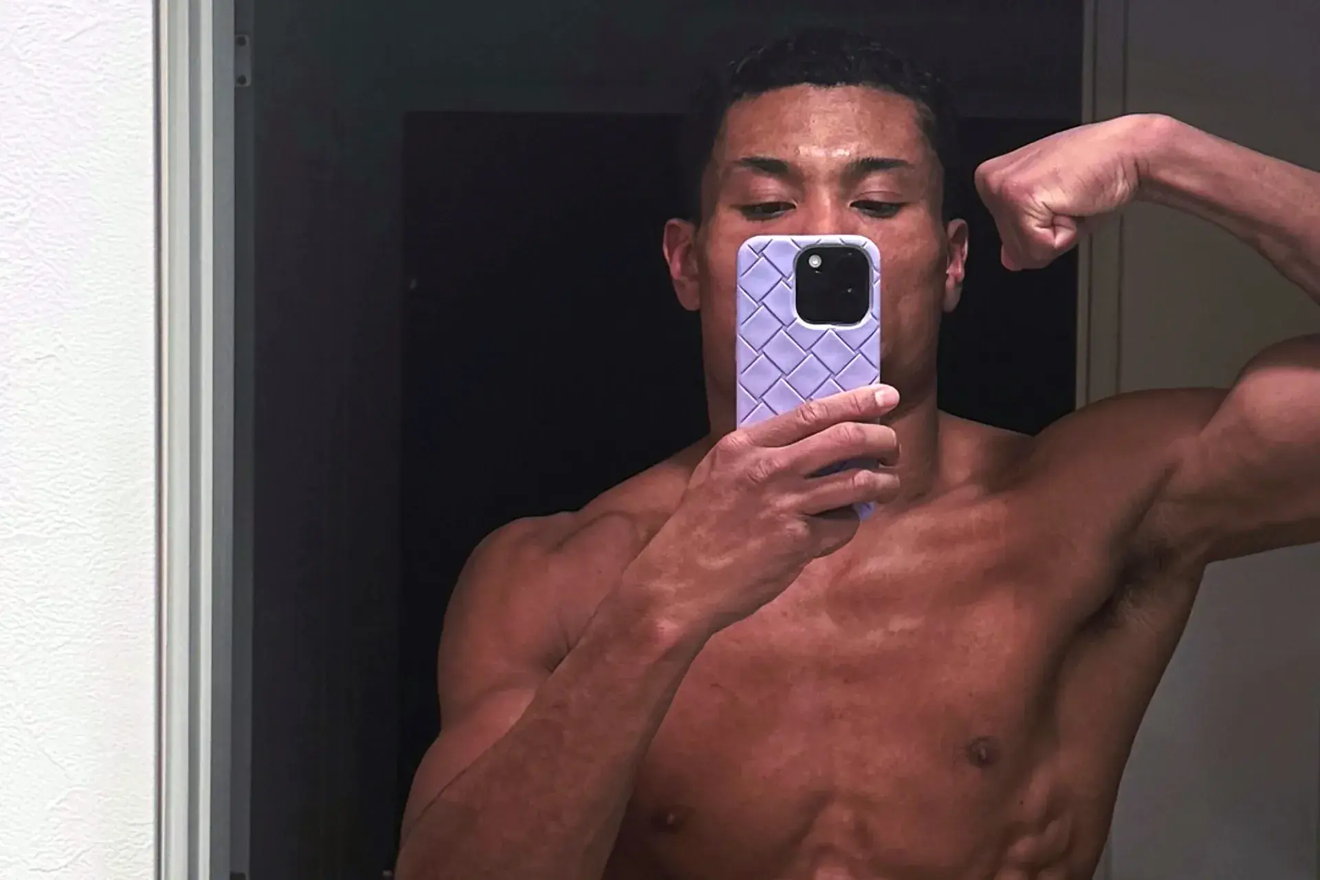 Andy Hiraoka flashes his chiseled physique ahead of his February 21 challenge of WBA 140 lb. titlist Gary Antuanne Russell in Las Vegas, Nevada.
