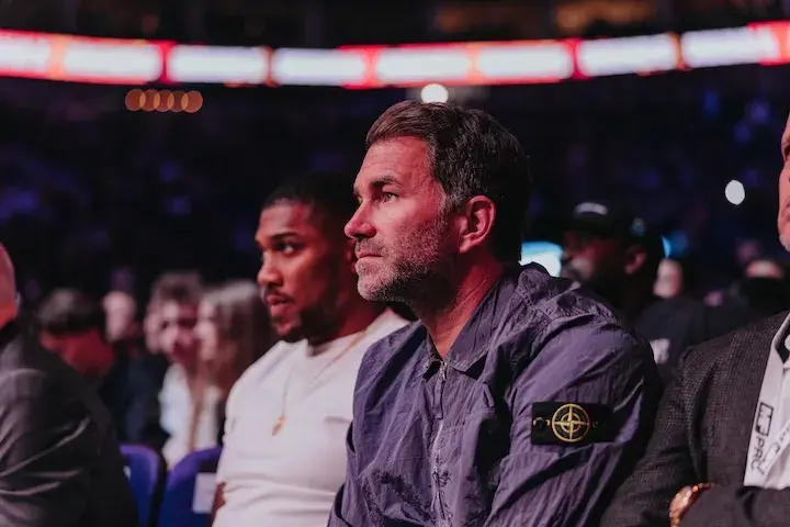 Anthony Joshua (left) and Eddie Hearn watch Deontay Wilder win a split decision over Derek Chisora Saturday at London's 02 Arena. (April 4, 2026)