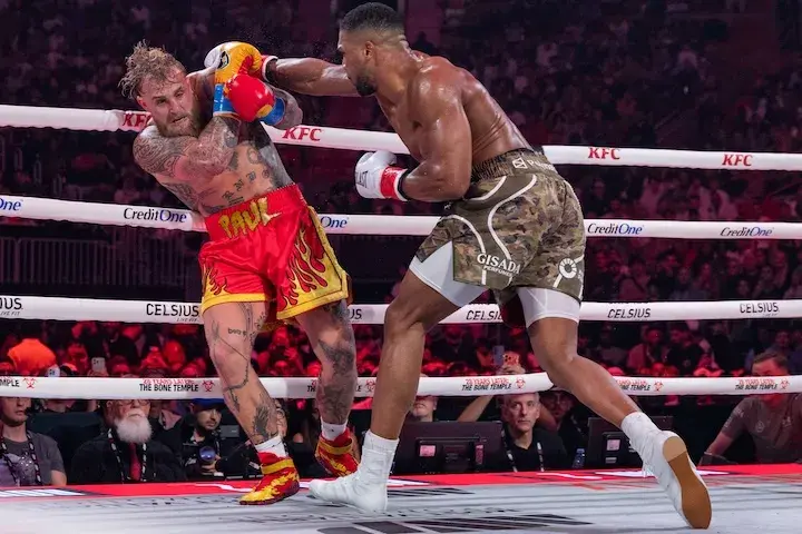 Anthony Joshua throws a big right hand at Jake Paul during their boxing match on December 19, 2025.