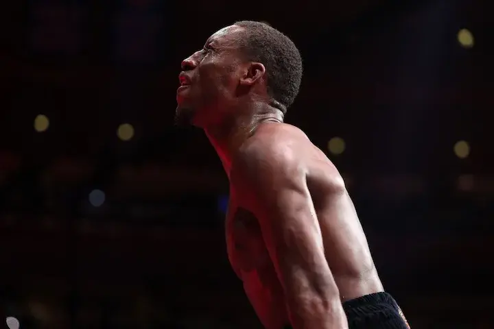 Bruce Carrington celebrates his victory over Carlos Castro to win the vacant WBC featherweight title on January 31, 2026.