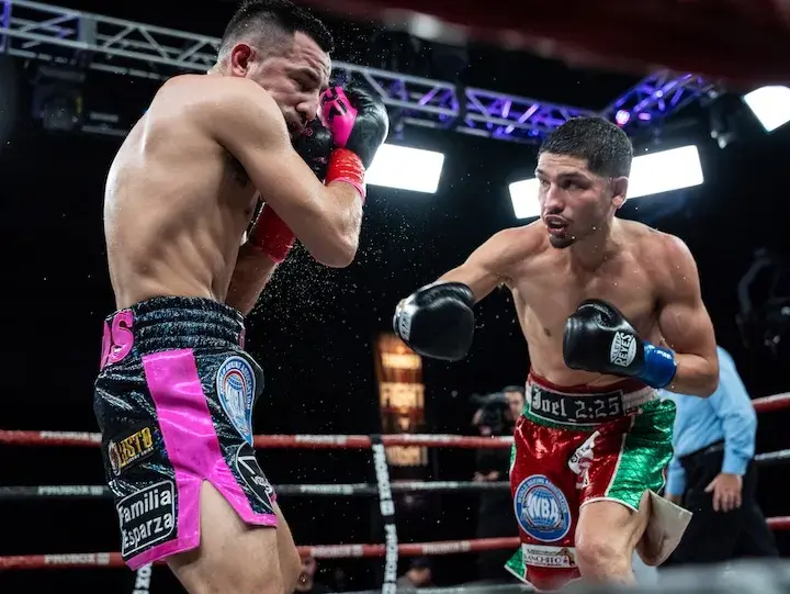 Bryan Acosta (right) throws a punch toward Ronny Rios during their main event fight at Thunder Studios in Long Beach, California. (March 28, 2026)