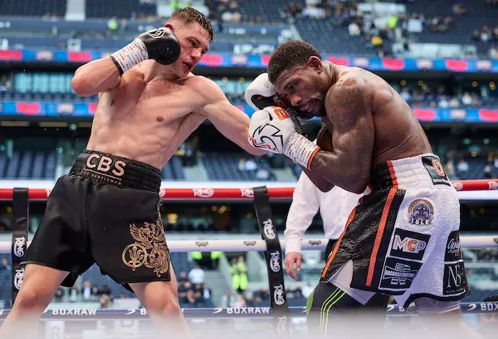 Chris Billam-Smith lands a left hand to the chest of Brandon Glanton in their fight on April 26, 2025.