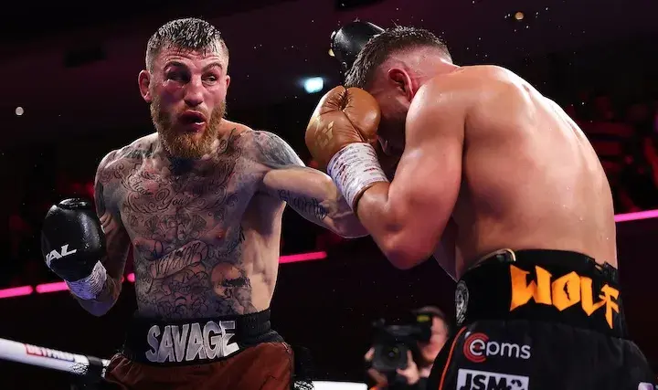 Sam Eggington (left) lands a punch on Conah Walker. (May 2, 2026)