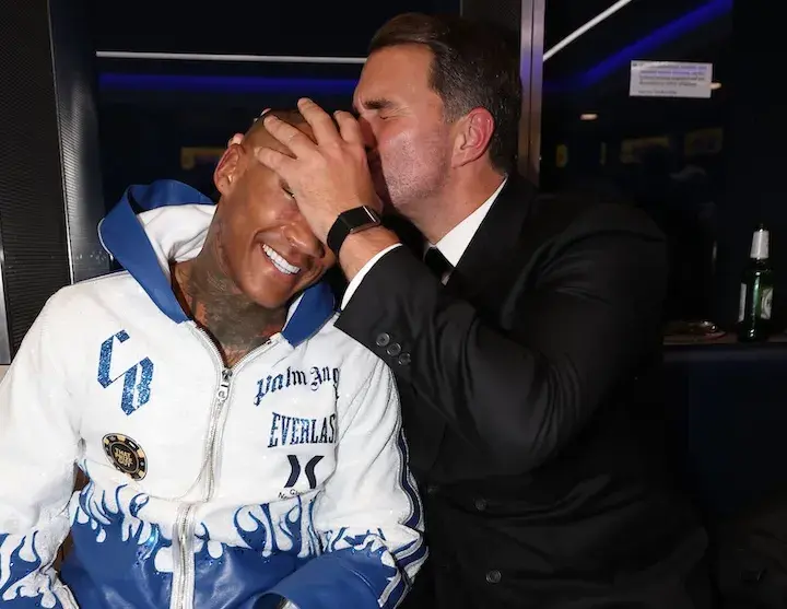 Eddie Hearn plants a kiss on the head of Conor Benn after beating Chris Eubank Jnr in November 2025