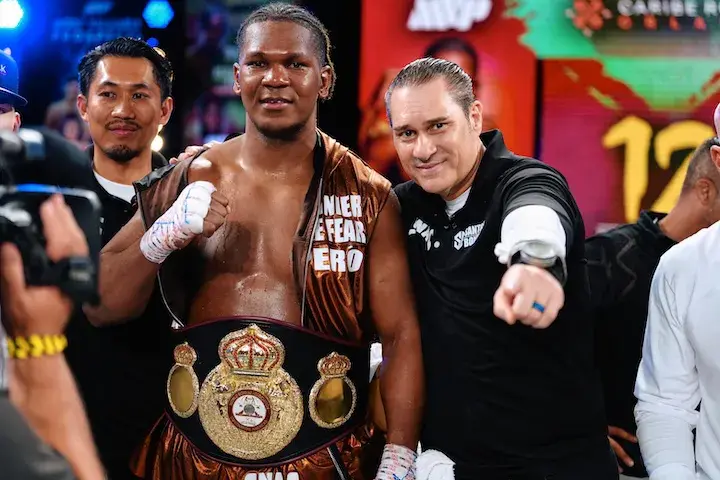 Dainier Pero stands next to his boxing trainer Bob Santos