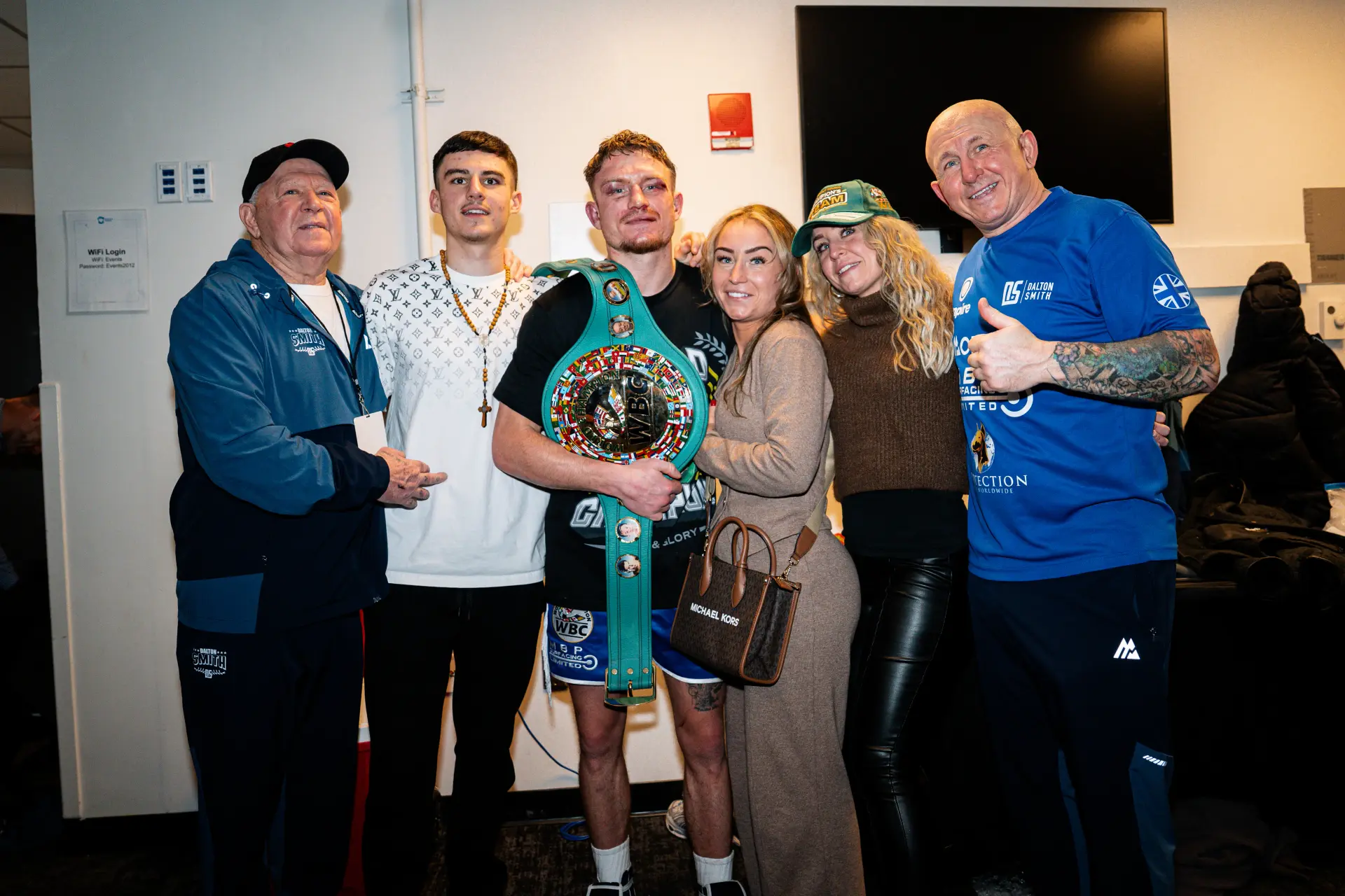 Dalton Smith celebrates with his team backstage after knocking out Subriel Matias on January 10, 2026, for the WBC junior welterweight title.