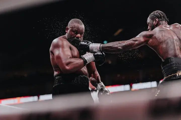 Deontay Wilder (right) lands a jab on Derek Chisora during their heavyweight battle Saturday at London's 02 Arena. (April 4, 2026)