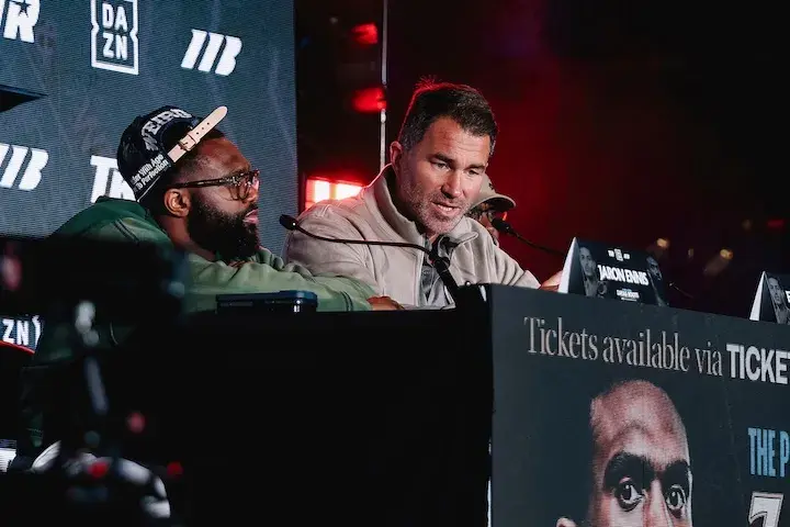 Eddie Hearn (right) and Jaron Ennis (left) talk at the the Brooklyn, New York press conference for Ennis' fight against Xander Zayas. (April 8, 2026)