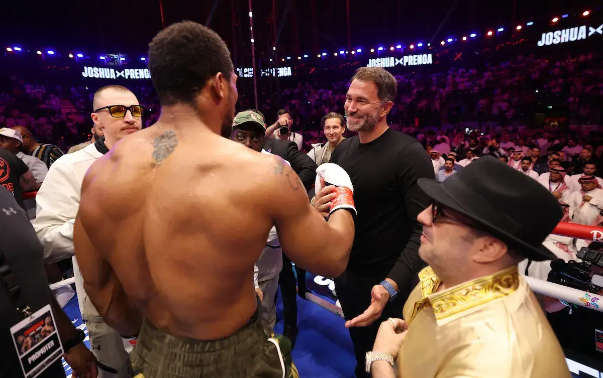 Eddie Hearn congratulates Anthony Joshua, with Sergey Lapin to his left, following dramatic win over Kristian Prenga