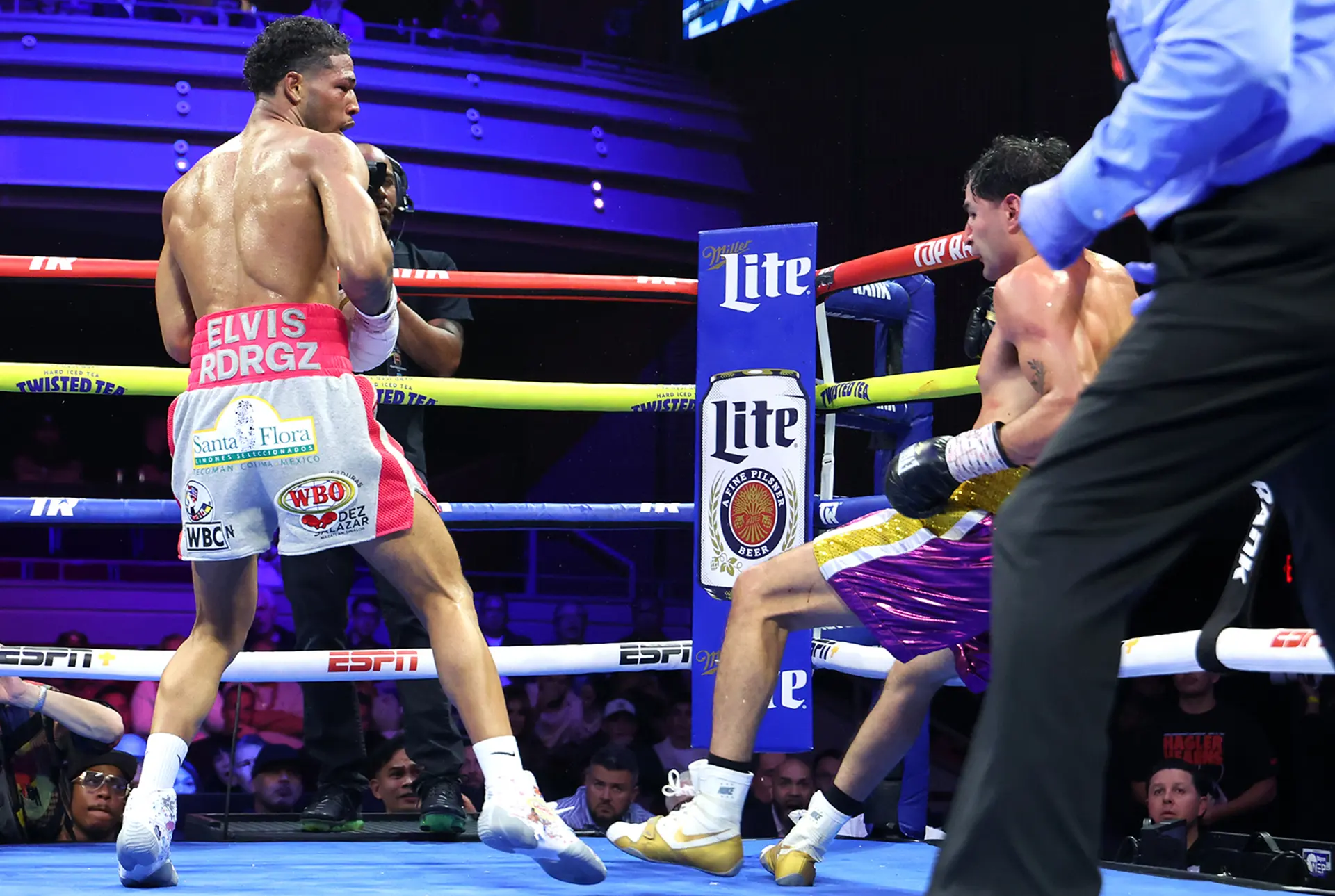 Elvis Rodriguez drives Lindolfo Delgado into ropes