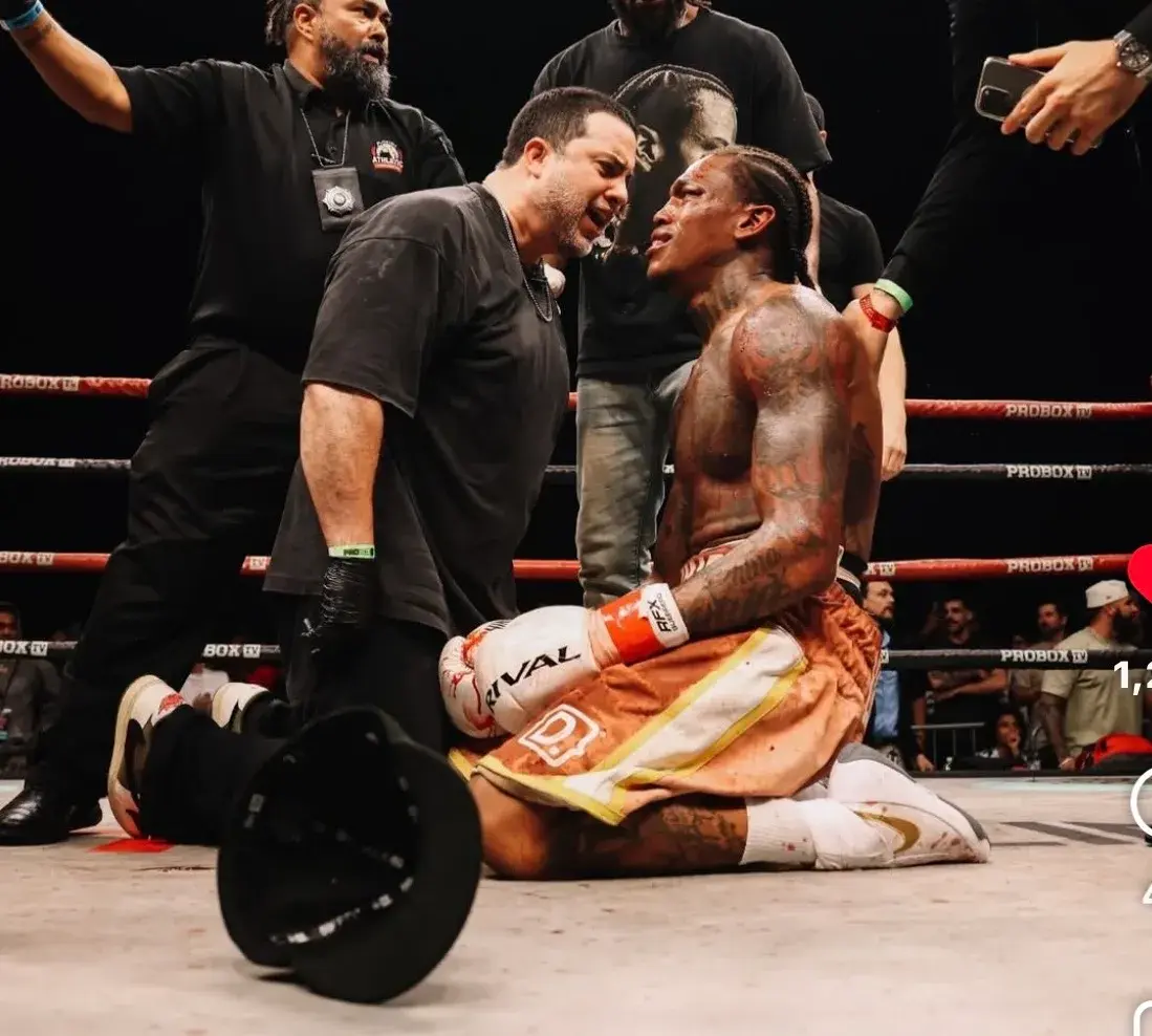 Trainer Marc Farrait and Najee Lopez celebrate victory over Gallegos