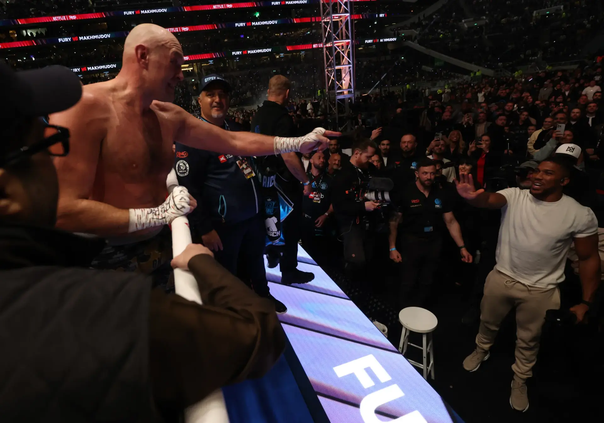 Tyson Fury invites Anthony Joshua to the ring after Fury's victory over Arslanbek Makhmudov on April 11, 2026.