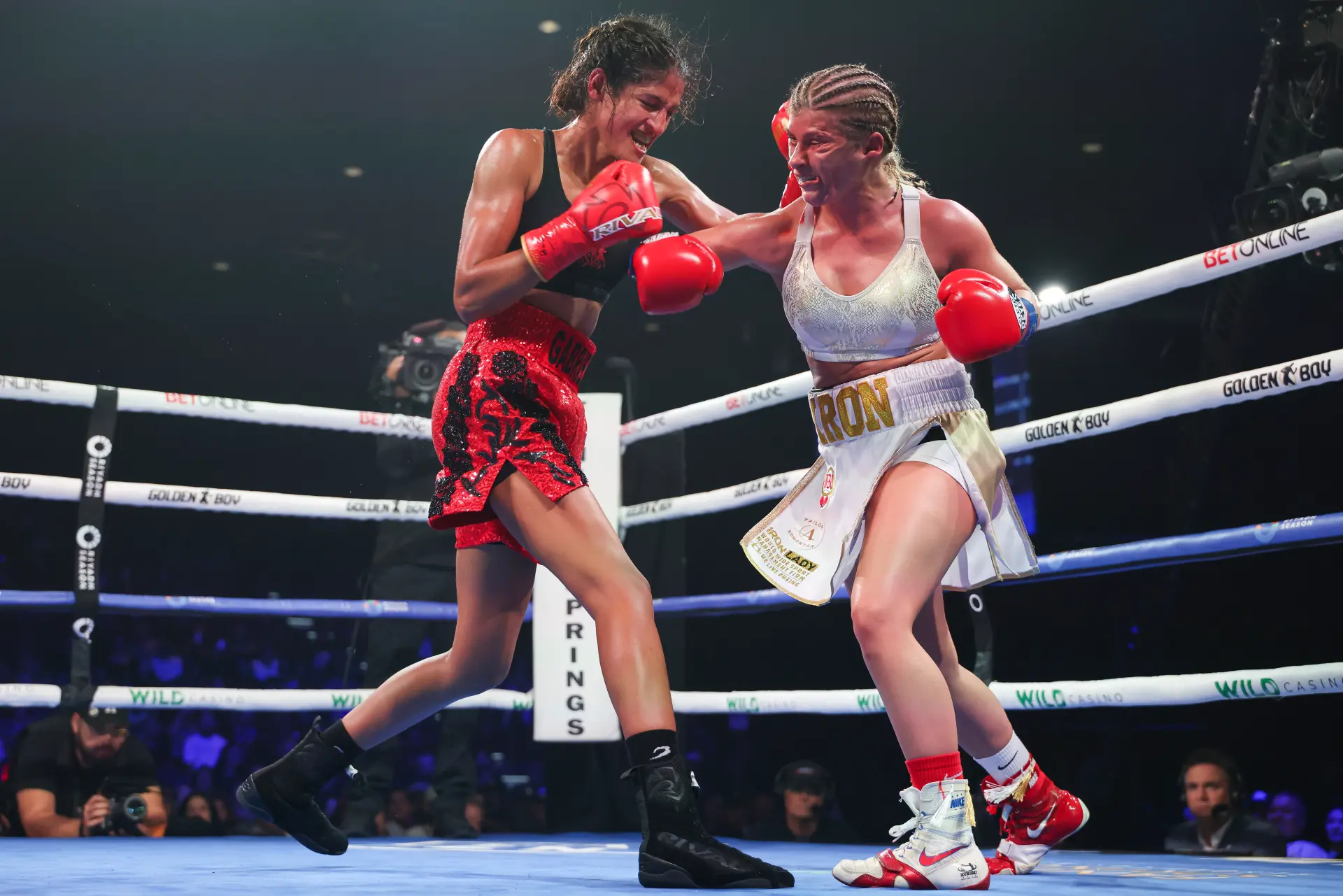 Gabriela Fundora (left) and Alexas Kubicki trade punches during their September 2025 boxing match.
