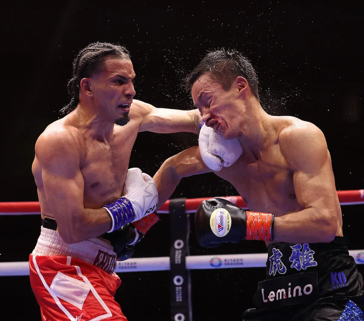 Eridson Garcia (left) lands a left hook on Taiga Imanaga during their boxing matchon December 27, 2025.