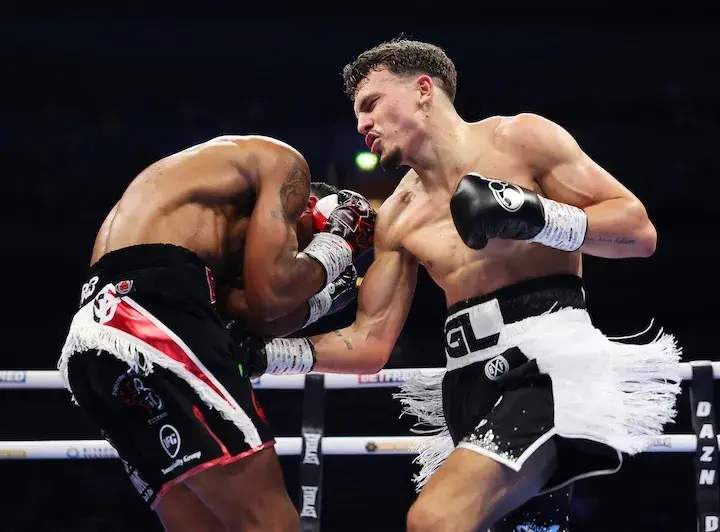 George Liddard (right) lands a punch on Tyler Denny. (March 21, 2026)