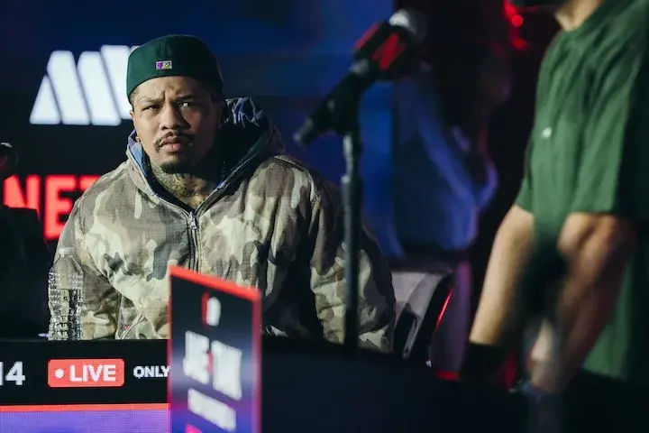 Gervonta Davis looks up at a person speaking at a microphone during a press conference on September 22, 2025, for Davis' exhibition match with Jake Paul.