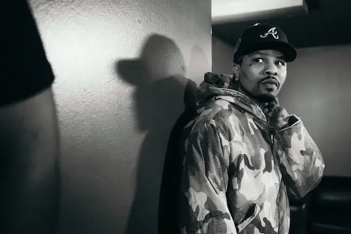 Gervonta Davis stands by a wall at a press conference event on September 22, 2025, for his exhibition match with Jake Paul.