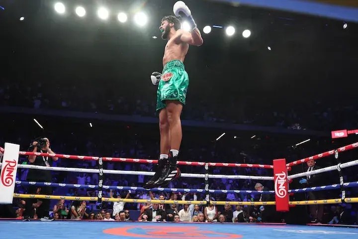 Hamzah Sheeraz leaps high in the air in celebration of his knockout victory over Edgar Berlanga on July 12, 2025.