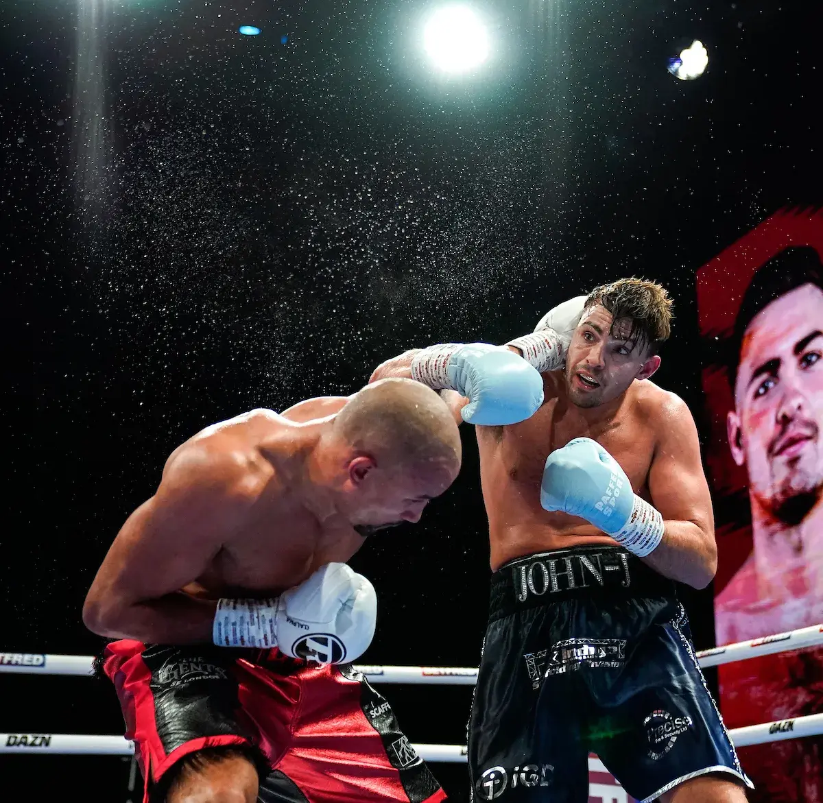 John Hedges (right) and Ellis Zorro trade punches during their boxing match on December 17, 2025.
