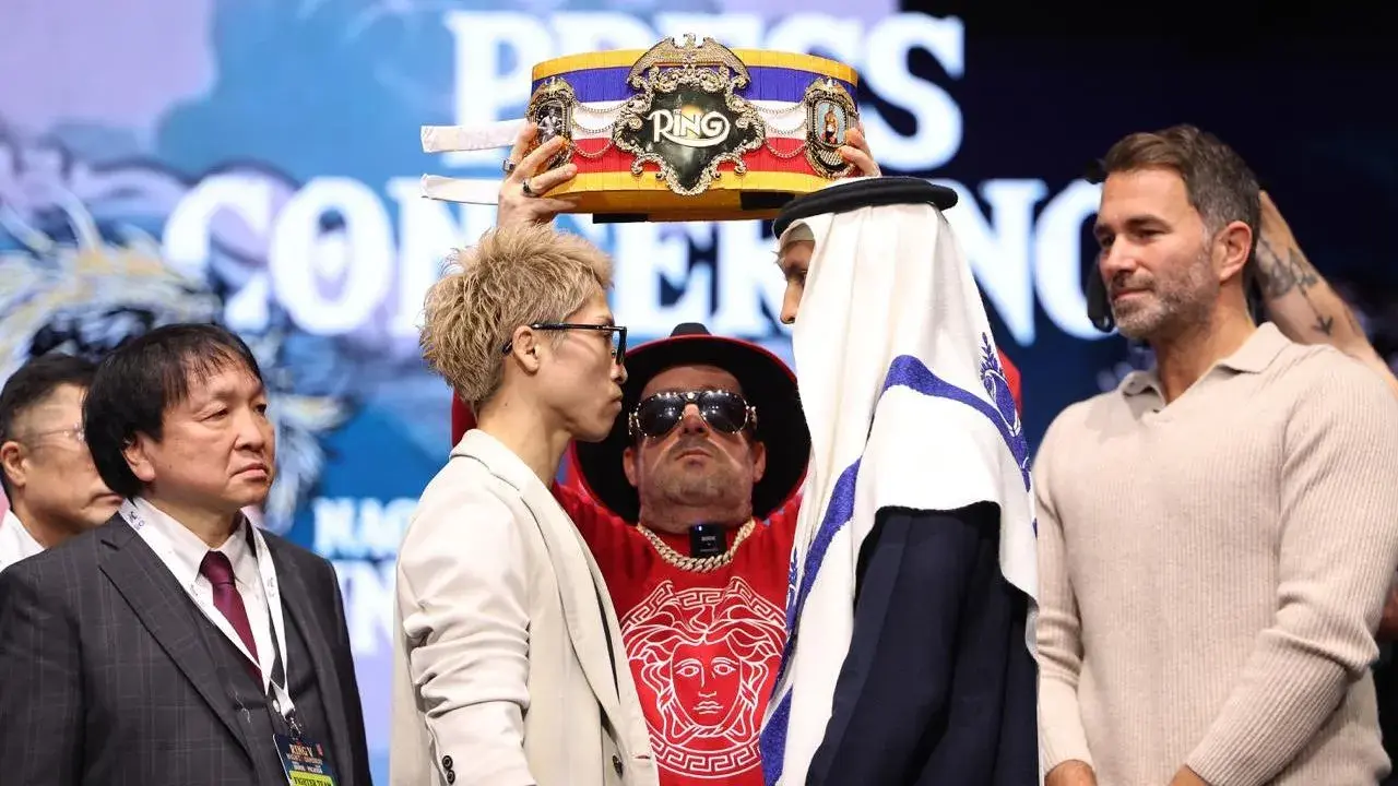 Naoya Inoue stands onstage at a press conference ahead of his boxing match with Alan David Picasso in December 2025.