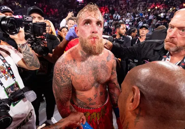 His jaw broken, Jake Paul looks up after being knocked out by Anthony Joshua during their boxing match on December 19, 2025.