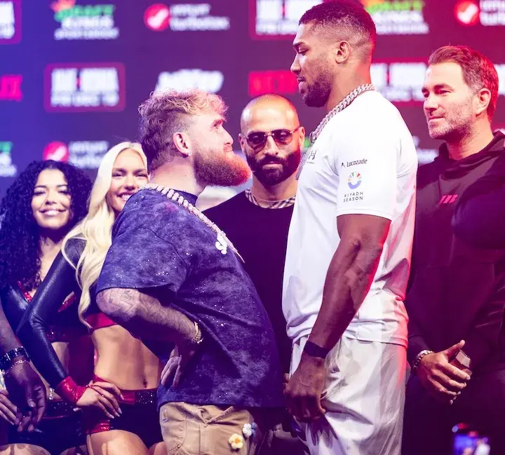 The height difference between Jake Paul (left) and Anthony Joshua is evident as they pose for photos on December 17, 2025, at a press conference days before their boxing match.