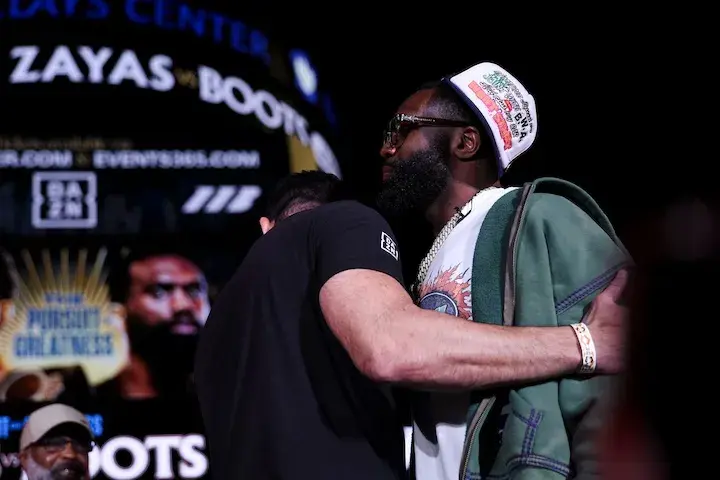 Jaron Ennis is held back after a heated face off with Xander Zayas. (April 8, 2026)