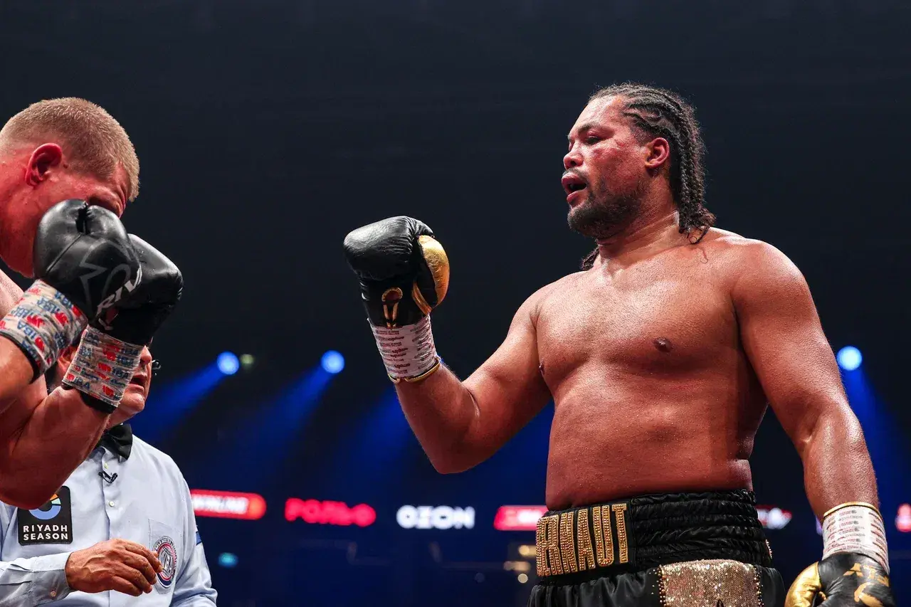 Joe Joyce waves his surrender to Artem Suslenkov in their fight, July 11, 2026