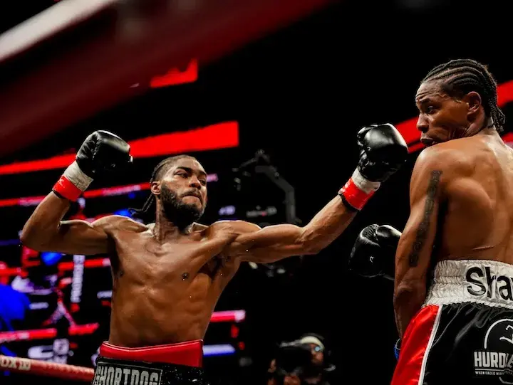 Jordan White (left) throws a punch at Willie Shaw on January 30, 2026