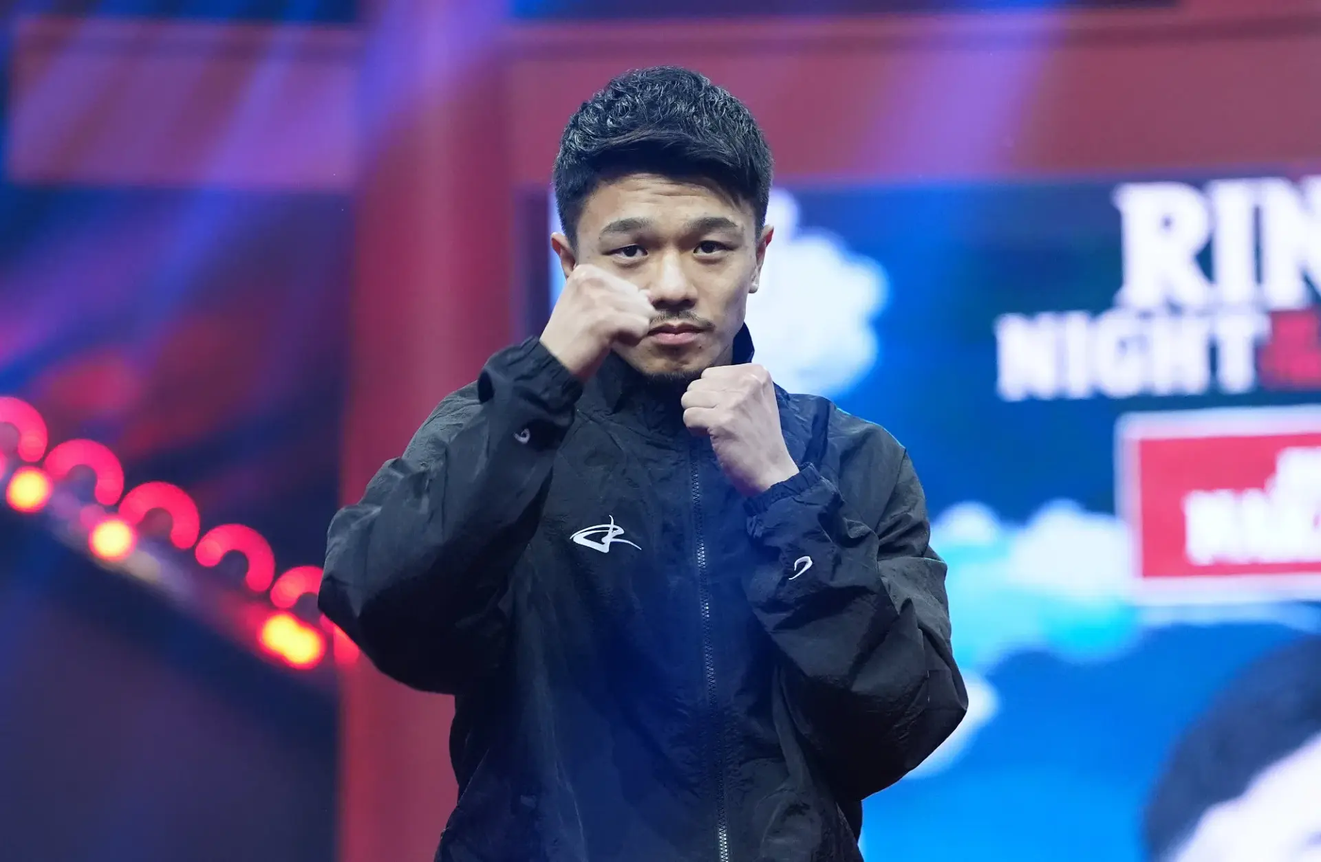 Junto Nakatani holds his fists up at the grand arrivals for his December 2025 boxing match with Sebastian Hernandez.