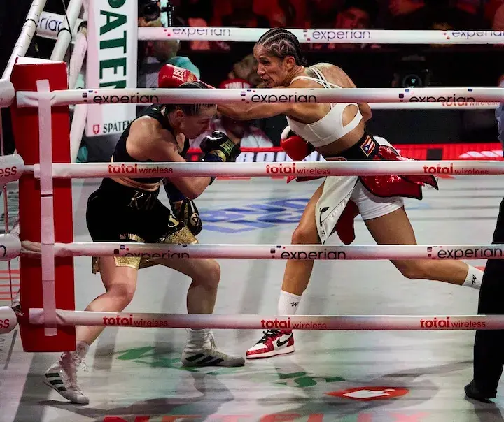 Katie Taylor ducks a jab from Amanda Serrano en route to a decision win in their third fight on July 11, 2025.