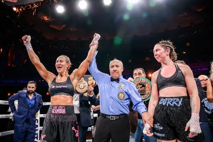 Kaye Scott raises her arms in celebration after defeating Olivia Curry for the WBA and WBC middleweight titles in their rematch on December 20, 2025.