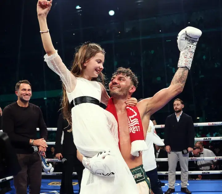 Leigh Wood celebrates with his daughter after his win over Josh Warrington. (February 21, 2026)