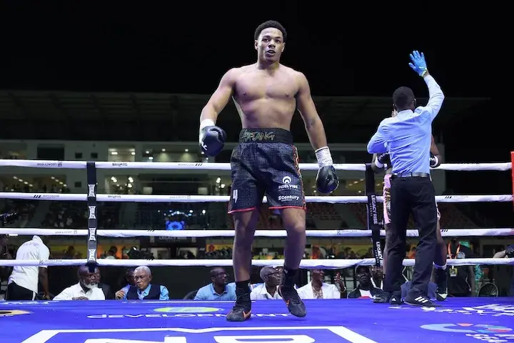 Leo Atang walks away after stopping Babu Yusuf in the first round of their boxing match on December 20, 2025.