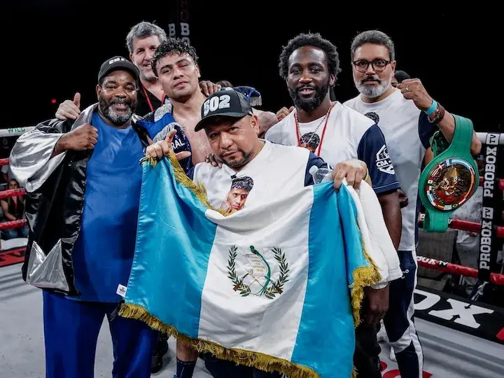 Lester Martinez poses with the full team, including five-division champion Terence "Bud" Crawford and head trainer Brian "Bomac" McIntyre after his knockout win over Joeshon James on March 22, 2025 in San Bernardino, California.